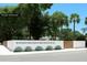 Stylish barrier wall and gate design complemented by desert plants at 3801 Dr Martin Luther King Jr N St, St Petersburg, FL 33703