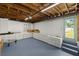 Finished basement with built-in white cabinets and shelving, providing ample storage space at 3801 Dr Martin Luther King Jr N St, St Petersburg, FL 33703