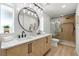 Contemporary bathroom with a double vanity, modern fixtures, a large mirror, and a glass-enclosed shower at 3801 Dr Martin Luther King Jr N St, St Petersburg, FL 33703