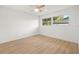 Bright bedroom features sleek ceiling fan and large window for ample natural light at 3801 Dr Martin Luther King Jr N St, St Petersburg, FL 33703