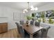 Bright dining room with modern lighting, comfortable seating, and a window at 3801 Dr Martin Luther King Jr N St, St Petersburg, FL 33703