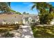 Charming single story home with a landscaped front yard and a walkway leading to the front door at 3801 Dr Martin Luther King Jr N St, St Petersburg, FL 33703