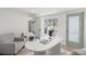 Stylish home office with modern desk, gray chair, and tranquil backyard view at 3801 Dr Martin Luther King Jr N St, St Petersburg, FL 33703