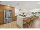 Bright, updated kitchen featuring a large island with seating, stainless steel appliances, and pendant lighting at 3801 Dr Martin Luther King Jr N St, St Petersburg, FL 33703