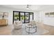 Bright sitting area with neutral decor and access to the lanai at 3801 Dr Martin Luther King Jr N St, St Petersburg, FL 33703