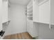 Bright walk-in closet features custom shelving and drawers for optimal storage at 3801 Dr Martin Luther King Jr N St, St Petersburg, FL 33703