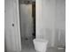 Bathroom in need of renovation, featuring exposed plumbing and an unfinished toilet at 420 Moorings Cove Dr # 420, Tarpon Springs, FL 34689