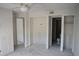 Spacious bedroom features open closets and smooth concrete floors, offering a versatile and adaptable space at 420 Moorings Cove Dr # 420, Tarpon Springs, FL 34689
