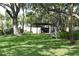 View of the community's bike storage and manicured lawn at 420 Moorings Cove Dr # 420, Tarpon Springs, FL 34689