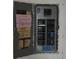 View of electrical panel, showing breakers and electrical system, in need of updating at 420 Moorings Cove Dr # 420, Tarpon Springs, FL 34689
