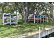 View of community kayak storage facility on a manicured lawn at 420 Moorings Cove Dr # 420, Tarpon Springs, FL 34689