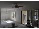 Living room with a combination of natural light from sliding glass doors and a picturesque window at 420 Moorings Cove Dr # 420, Tarpon Springs, FL 34689