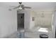 An open-concept living room ready for finishes, with a kitchen view and modern lighting fixtures at 420 Moorings Cove Dr # 420, Tarpon Springs, FL 34689