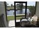 View from the screened patio overlooking the canal at 420 Moorings Cove Dr # 420, Tarpon Springs, FL 34689