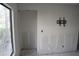 Renovation-ready room with an installed TV mount and door, offering potential for custom design at 420 Moorings Cove Dr # 420, Tarpon Springs, FL 34689