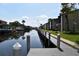 Community waterfront view of a boat dock along the calm water at 420 Moorings Cove Dr # 420, Tarpon Springs, FL 34689
