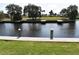 A tranquil waterfront view with docks and calm canal waters at 420 Moorings Cove Dr # 420, Tarpon Springs, FL 34689
