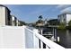A white fence provides privacy from the canal at 420 Moorings Cove Dr # 420, Tarpon Springs, FL 34689