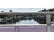 Canal view showing multiple boats docked on the calm waterway of this beautiful waterfront property at 420 Moorings Cove Dr # 420, Tarpon Springs, FL 34689
