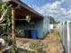 Backyard of a home with a covered area and partial fencing at 4506 Eden Rock Rd, Tampa, FL 33634