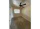 Basic bedroom with carpet and window and basic ceiling fan at 4506 Eden Rock Rd, Tampa, FL 33634