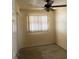 Standard bedroom featuring a ceiling fan and a window with blinds, complemented by carpeted floors at 4506 Eden Rock Rd, Tampa, FL 33634