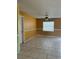 Open dining room featuring tile flooring, a modern ceiling fan, and a large window with natural light at 4506 Eden Rock Rd, Tampa, FL 33634