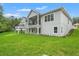 Expansive backyard features balconies, covered patios and well-maintained lawn offers ample outdoor enjoyment at 4522 Majestic Hills Loop, Brooksville, FL 34601