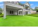 This covered backyard area with synthetic grass putting area is great for entertaining and relaxation at 4522 Majestic Hills Loop, Brooksville, FL 34601
