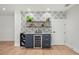 Home bar area with wine storage, display shelves, and decorative tile accent wall at 4522 Majestic Hills Loop, Brooksville, FL 34601