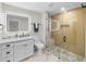 Modern bathroom with a glass shower, double vanity, and stylish fixtures at 4522 Majestic Hills Loop, Brooksville, FL 34601