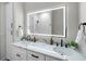 Elegant bathroom features dual sinks, marble counters, black hardware, and a spacious shower at 4522 Majestic Hills Loop, Brooksville, FL 34601
