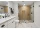 Modern bathroom with glass shower, marble countertops, and sleek black hardware at 4522 Majestic Hills Loop, Brooksville, FL 34601
