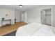 Serene bedroom with a comfortable bed, modern decor, and wood flooring at 4522 Majestic Hills Loop, Brooksville, FL 34601