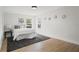 Bright bedroom features natural light, wood-look floors, accent rug, and calming wall decor at 4522 Majestic Hills Loop, Brooksville, FL 34601