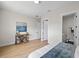 Bedroom features wood floors, neutral walls, view to bathroom, and attractive furnishings at 4522 Majestic Hills Loop, Brooksville, FL 34601