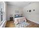 Bright bedroom features wood floors, neutral walls, large window, and attractive furnishings at 4522 Majestic Hills Loop, Brooksville, FL 34601