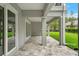 A covered patio featuring stone pavers and substantial support beams offers a tranquil outdoor retreat at 4522 Majestic Hills Loop, Brooksville, FL 34601