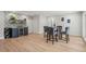 Dining area with a modern bar, stylish seating, and sleek finishes at 4522 Majestic Hills Loop, Brooksville, FL 34601