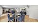 Dining area featuring a glass table, velvet chairs, and modern bar at 4522 Majestic Hills Loop, Brooksville, FL 34601