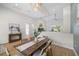 Dining area featuring a modern chandelier, high ceilings, and an open view to the living area at 4522 Majestic Hills Loop, Brooksville, FL 34601