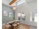 Bright dining room featuring a modern chandelier, high ceilings, and large windows at 4522 Majestic Hills Loop, Brooksville, FL 34601