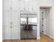 Modern kitchen with white cabinets, stainless steel appliances, and ample storage space at 4522 Majestic Hills Loop, Brooksville, FL 34601