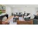 Inviting living room with stylish furniture, contemporary rug, and bright white walls at 4522 Majestic Hills Loop, Brooksville, FL 34601