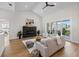 Bright living room with a fireplace, modern furnishings, and sliding glass doors to a patio at 4522 Majestic Hills Loop, Brooksville, FL 34601
