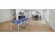 Open floor plan with ping pong table and a cozy bar area for entertaining at 4522 Majestic Hills Loop, Brooksville, FL 34601