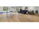 Spacious living room featuring modern flooring and a ping pong table at 4522 Majestic Hills Loop, Brooksville, FL 34601