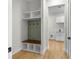 Mud room featuring hall tree with hooks, a wooden bench and views of the kitchen and laundry at 4522 Majestic Hills Loop, Brooksville, FL 34601