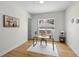Bright, neutral office space boasts a large window, wood floors, and contemporary decor at 4522 Majestic Hills Loop, Brooksville, FL 34601