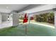 Outdoor space featuring a putting green with views of the trees at 4522 Majestic Hills Loop, Brooksville, FL 34601